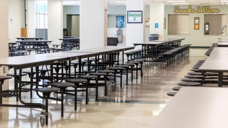 Michigan absenteeism inches down